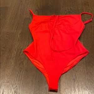 red bodysuit